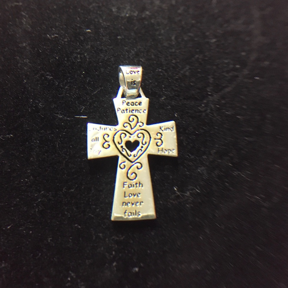 Silver “Love Is” Cross Pendant